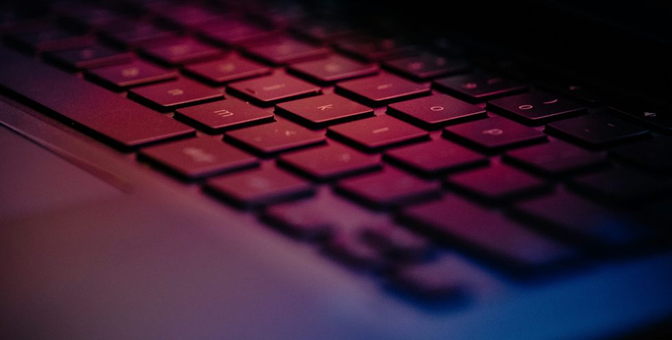 a-close-up-of-a-keyboard-with-a-blurry-background