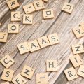 scrabble-letters-spelling-saas-on-a-wooden-tabl