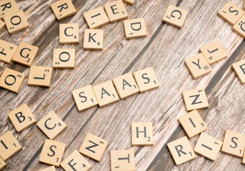 scrabble-letters-spelling-saas-on-a-wooden-tabl