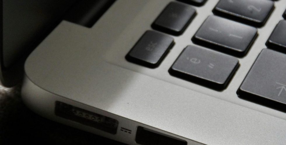 Free Detailed view of a silver laptop showing keyboard and multiple ports. Stock Photo
